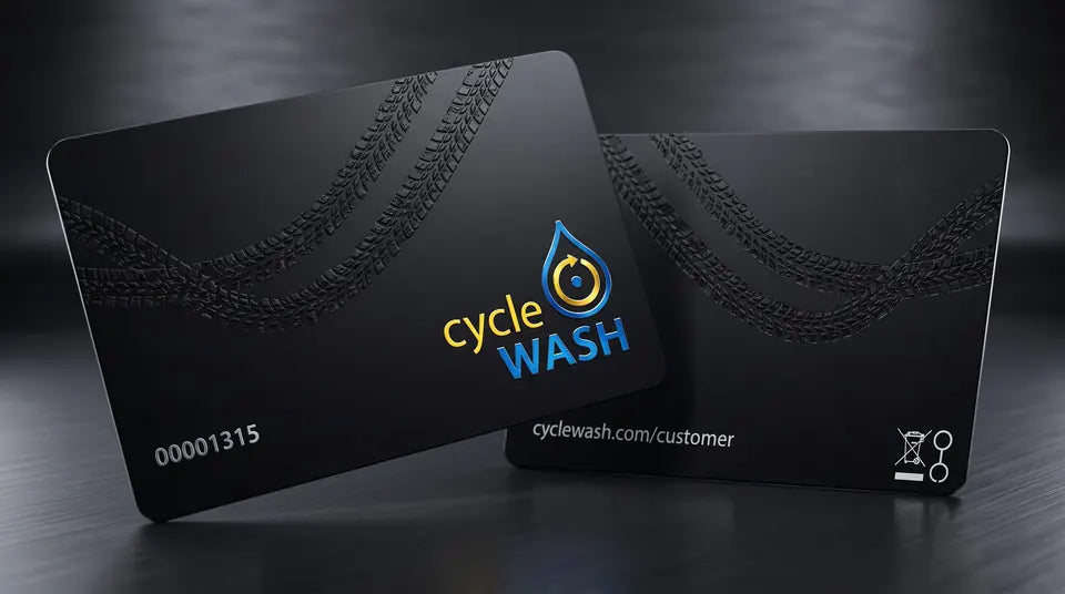 Two black cycleWASH cards with an embossed tyre track, card number 00001315 on the front and cyclewash.com/customer on the back