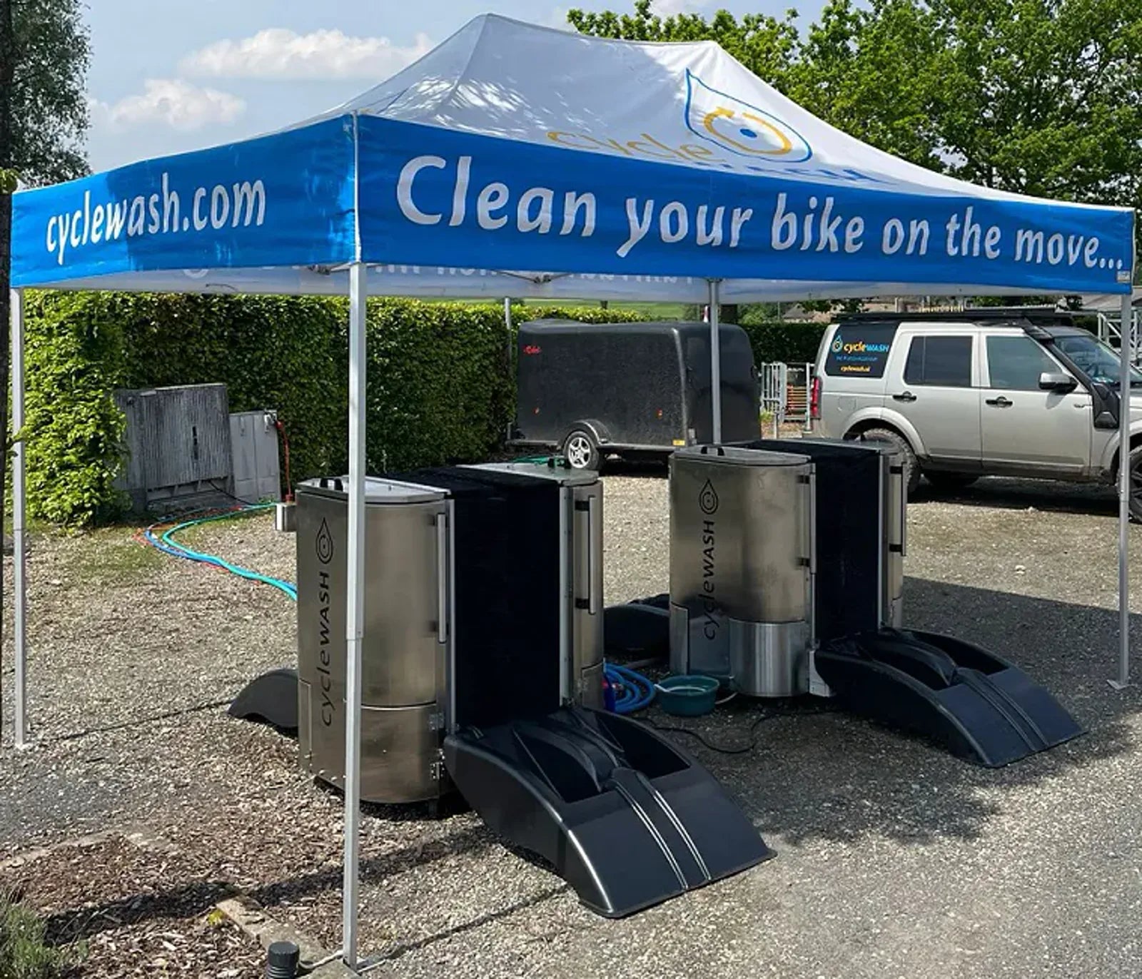 Two cycleWASH machines under a branded gazebo at Limburgs Mooiste 2024