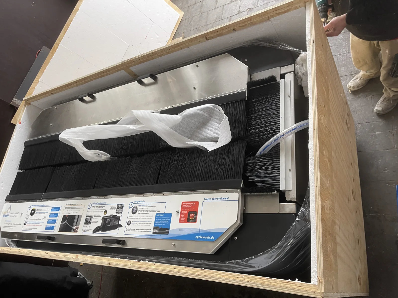 cycleWASH Pro inside its plywood crate, styrofoam lining lifted off