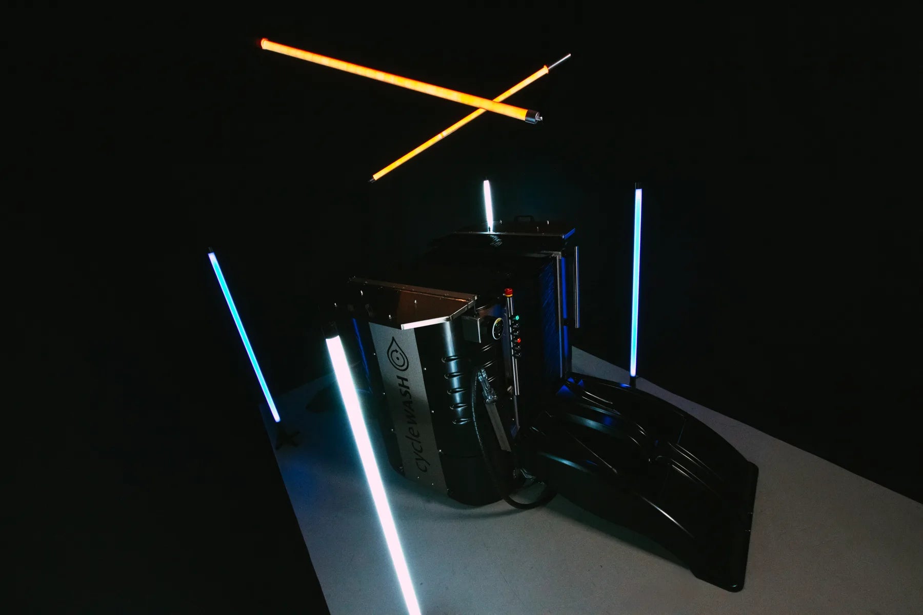 cycleWASH mini Platinum lit by neon tubes in the studio, loading ramp folded out