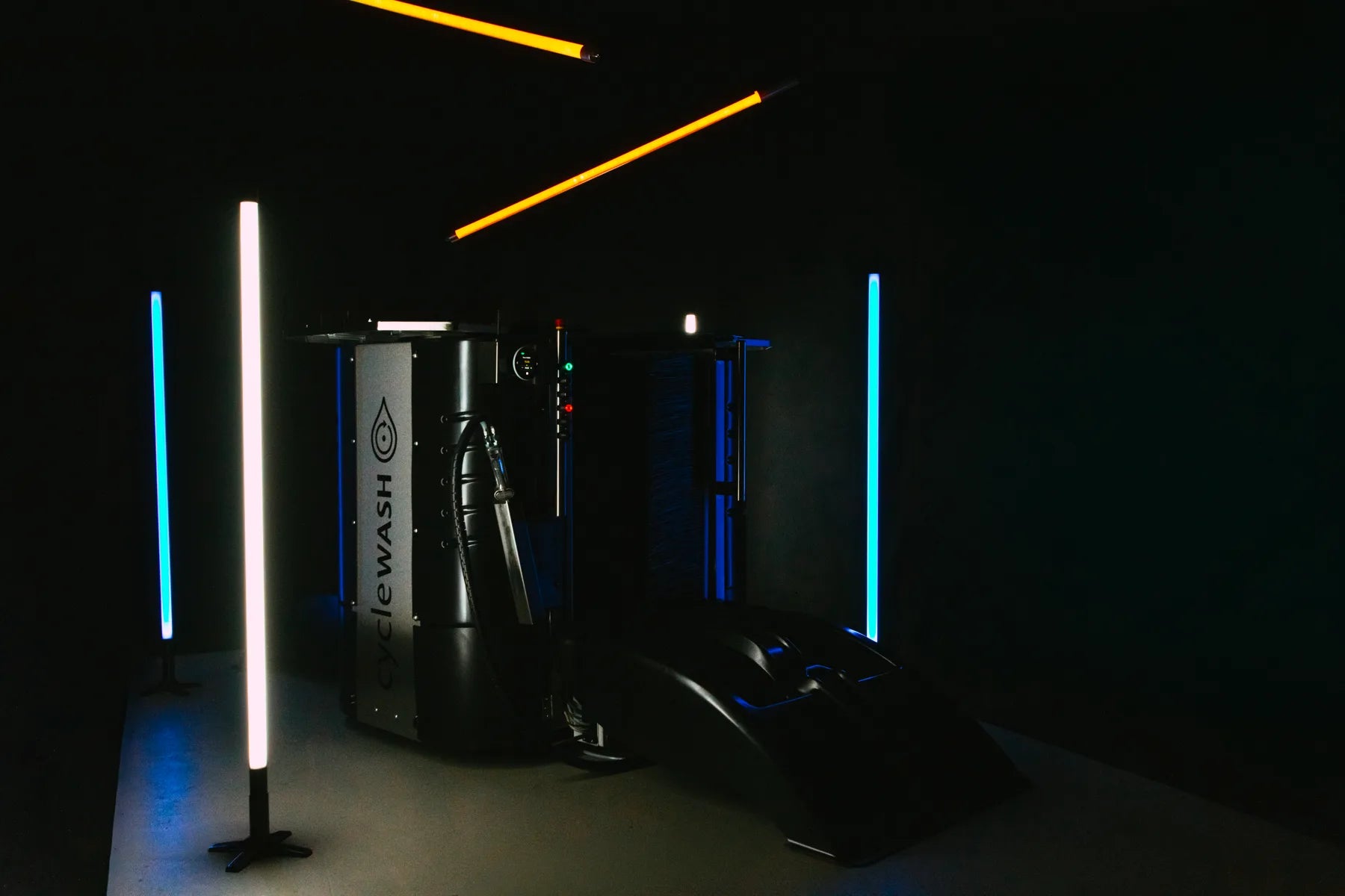 cycleWASH mini Platinum lit by neon tubes in the studio, ramp extended